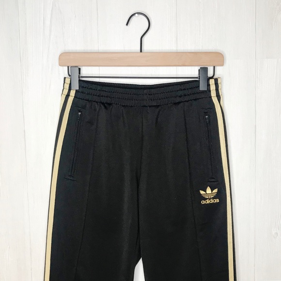 adidas track pants gold stripes